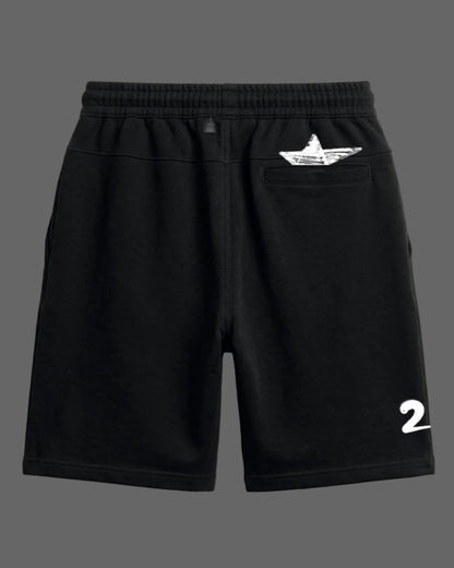 Black shorts with a white logo and number on a light gray background